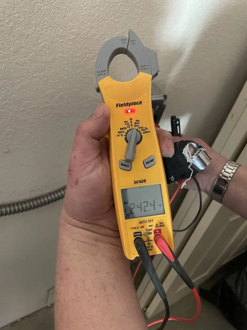 Voltage testing with clamp meter during Electrical Installation Services in Jericho
